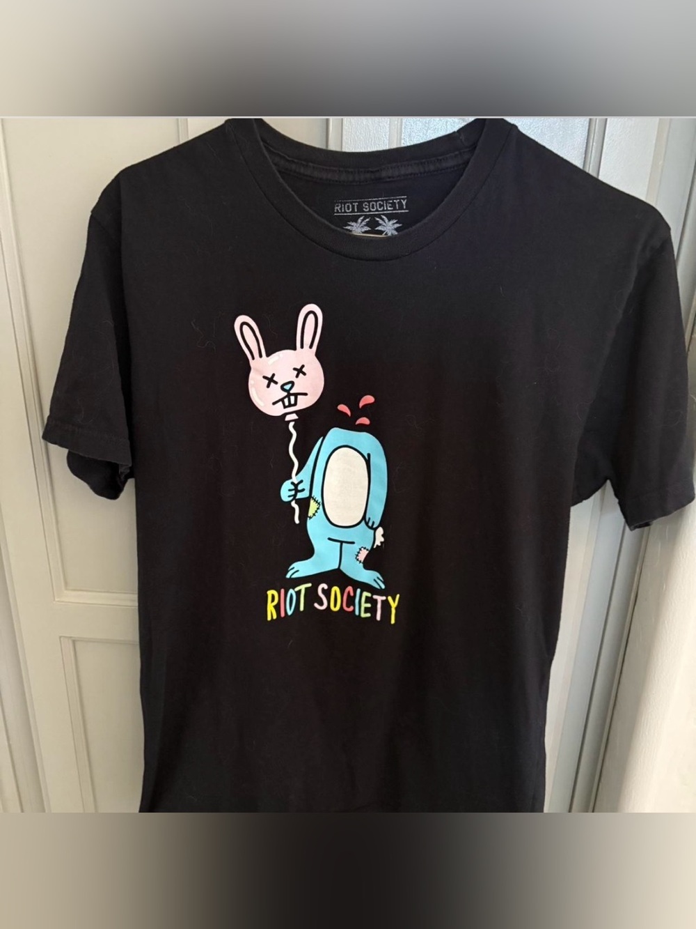 riot society Black Tee with Blue Character and Pink Balloon Bunny